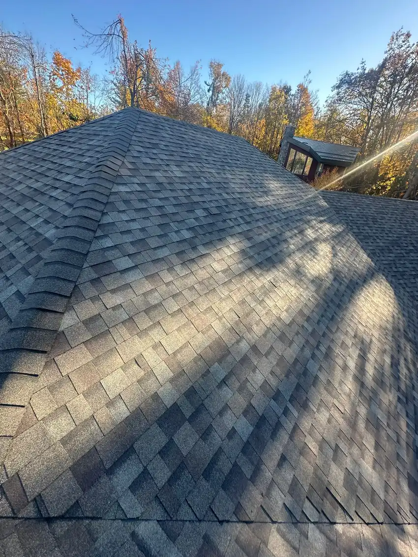 Detail of newly installed shingles and ridge cap